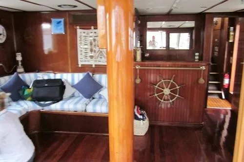  Yacht Photos Pics Interior of a 1962 Custom Southern yacht with wooden decor and nautical accents.