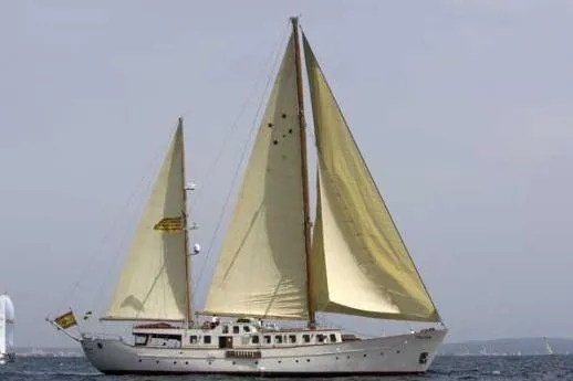  Yacht Photos Pics Vintage 1962 Custom Southern sailboat with yellow sails on open water.