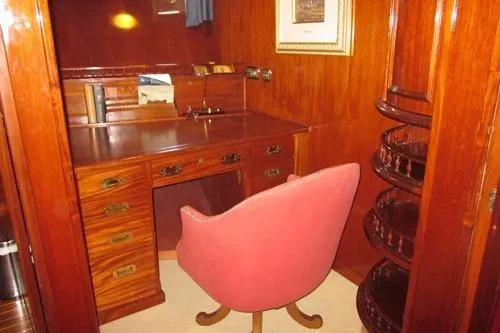  Yacht Photos Pics Vintage 1962 Custom Southern yacht interior with wooden desk and pink swivel chair.
