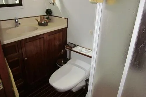  Yacht Photos Pics Compact 1962 Custom Southern bathroom with wooden cabinetry and modern fixtures.