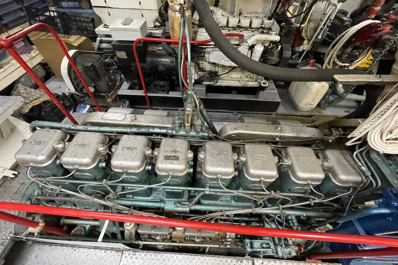  Yacht Photos Pics 1962 Custom Southern engine with multiple cylinders and intricate wiring in a workshop setting.
