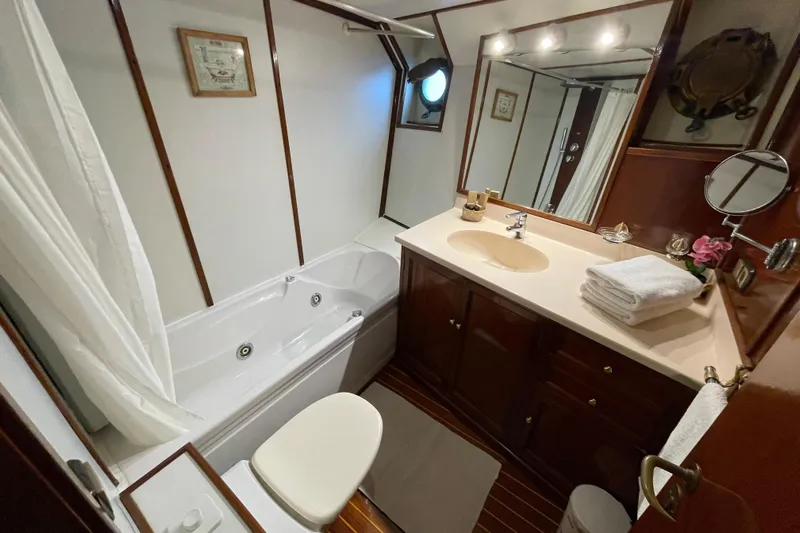  Yacht Photos Pics Luxurious 1962 Custom Southern yacht bathroom with jacuzzi, vanity, and elegant wood accents.