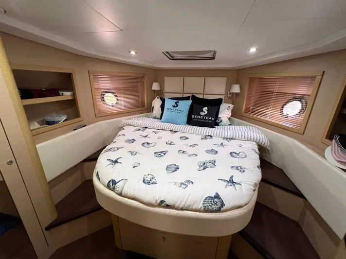  Yacht Photos Pics Luxurious cabin interior of 2010 Beneteau Monte Carlo 47 yacht with cozy bedding.