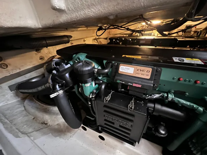  Yacht Photos Pics Engine room of 2010 Beneteau Monte Carlo 47 yacht, showcasing mechanical components and wiring.