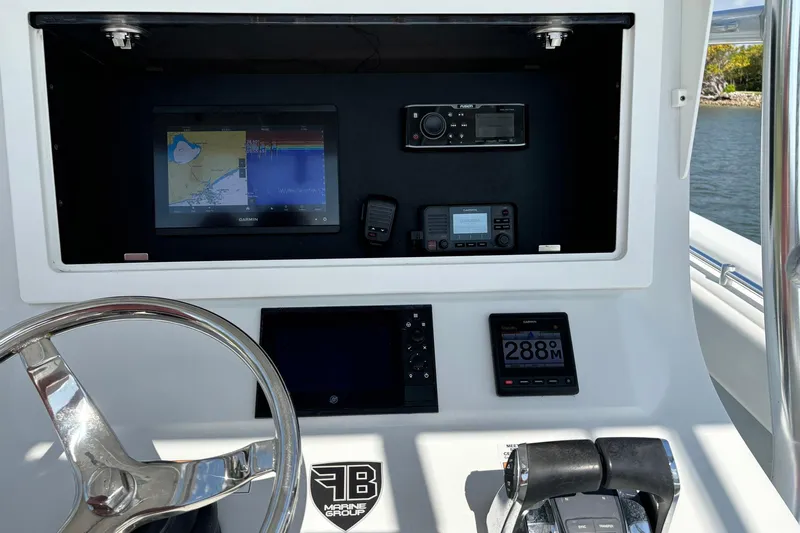  Yacht Photos Pics 2019 Contender 28 Sport boat dashboard with navigation and control systems.