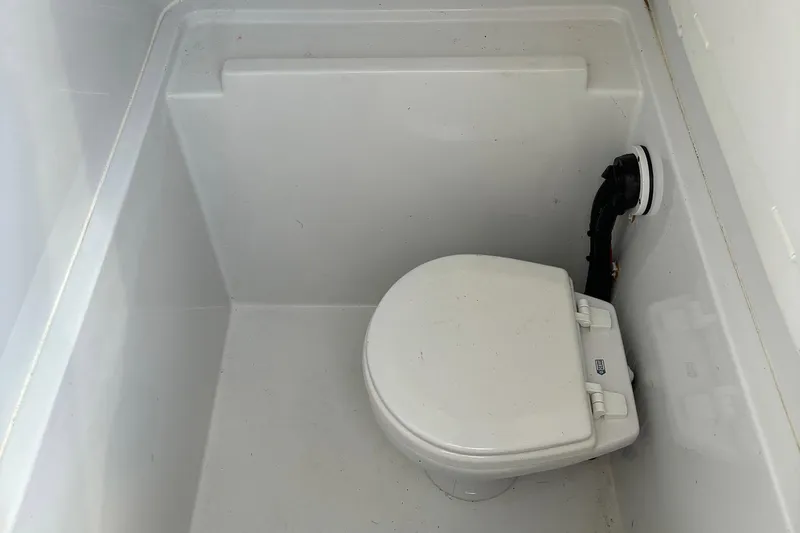  Yacht Photos Pics Boat toilet in a 2019 Contender 28 Sport, featuring a compact design.