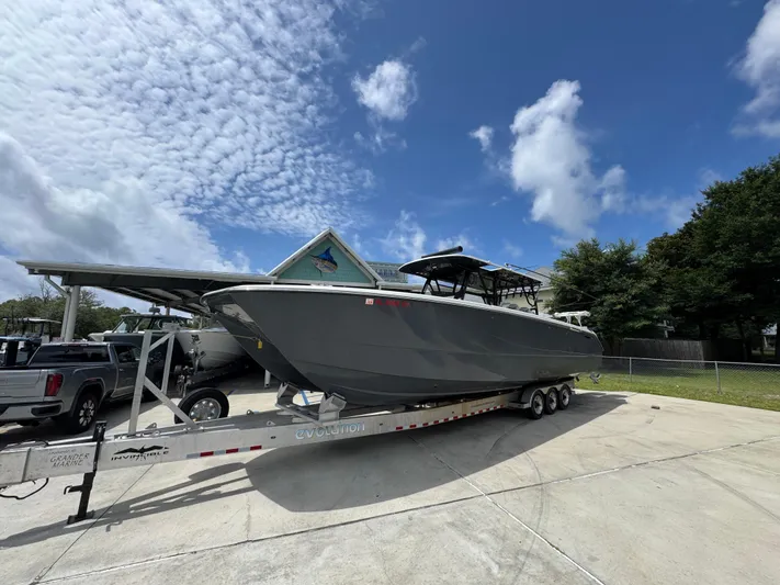  Yacht Photos Pics 2020 Invincible 40 Catamaran on trailer under blue sky with clouds.