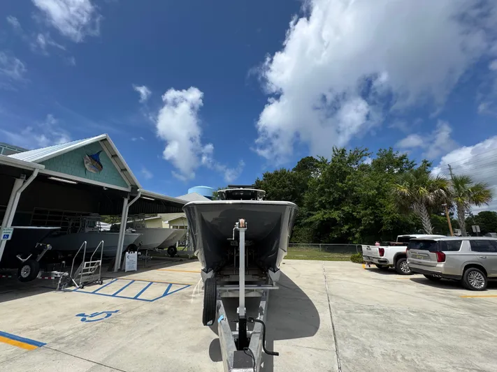  Yacht Photos Pics 2020 Invincible 40 Catamaran on trailer under a clear blue sky.