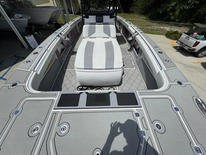  Yacht Photos Pics 2020 Invincible 40 Catamaran with spacious deck and seating, docked outdoors.