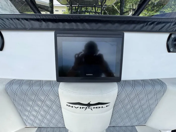  Yacht Photos Pics 2020 Invincible 40 Catamaran dashboard with Garmin display and quilted seating.