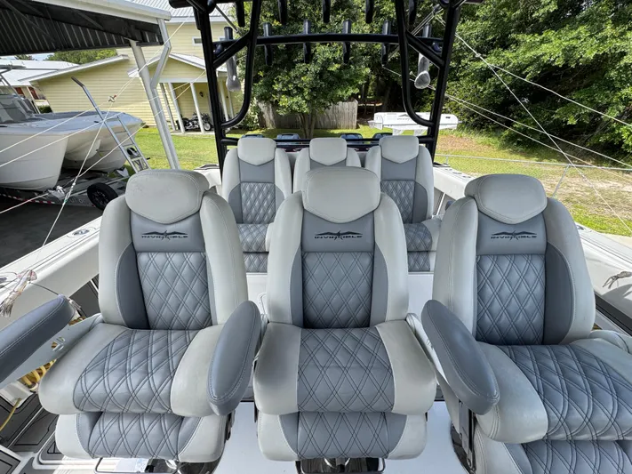  Yacht Photos Pics Luxurious seating on 2020 Invincible 40 Catamaran, featuring plush, diamond-stitched upholstery.
