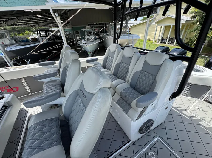  Yacht Photos Pics Luxurious seating on 2020 Invincible 40 Catamaran, featuring plush, diamond-stitched upholstery.