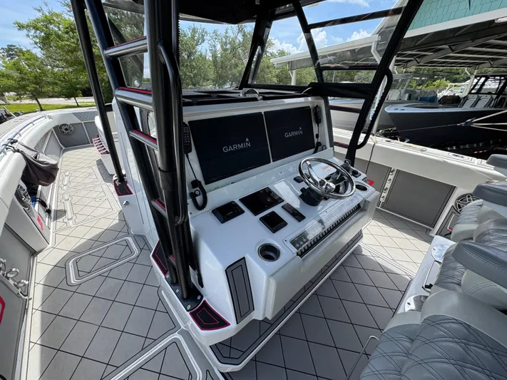  Yacht Photos Pics 2020 Invincible 40 Catamaran helm with Garmin displays and modern controls.