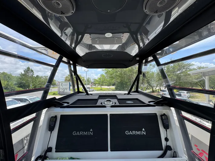  Yacht Photos Pics 2020 Invincible 40 Catamaran cockpit with Garmin navigation systems and overhead speakers.