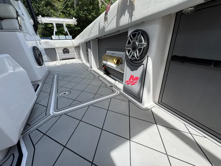  Yacht Photos Pics 2020 Invincible 40 Catamaran deck with modern design, featuring speakers and storage compartments.