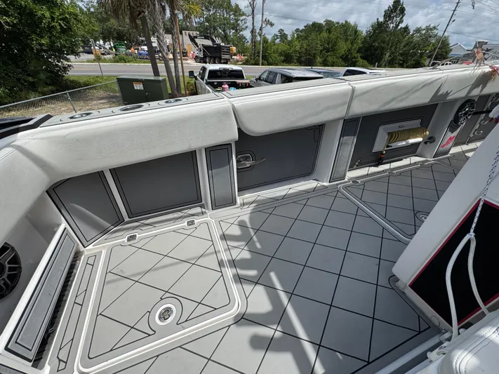  Yacht Photos Pics 2020 Invincible 40 Catamaran deck with cushioned seating and storage compartments.