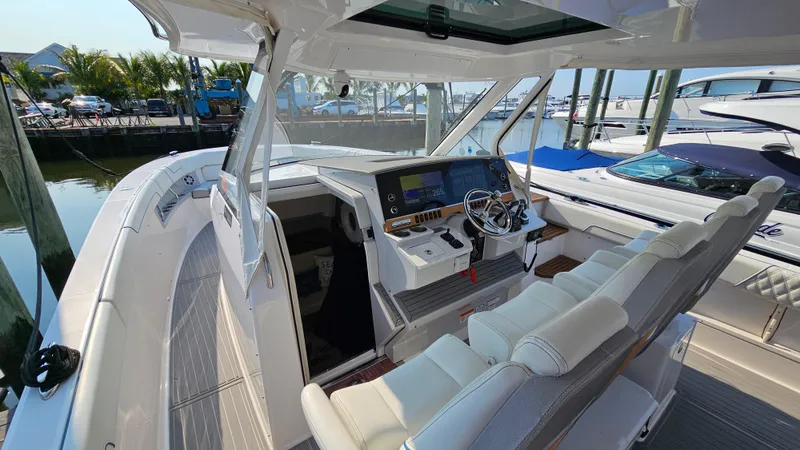  Yacht Photos Pics 2021 Regal 38 SAV boat interior with modern helm and seating.