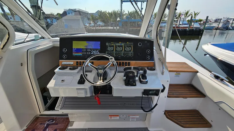  Yacht Photos Pics 2021 Regal 38 SAV boat helm with modern controls and navigation displays.