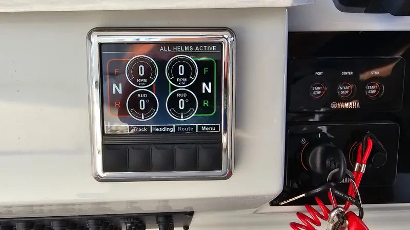  Yacht Photos Pics Control panel of 2021 Regal 38 SAV boat with digital display and Yamaha controls.