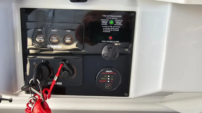  Yacht Photos Pics Control panel of a 2021 Regal 38 SAV boat with Yamaha ignition switches.
