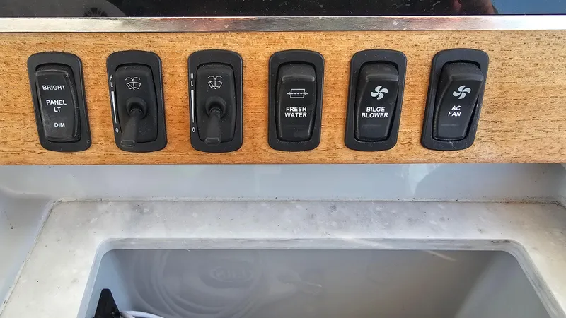  Yacht Photos Pics Control panel of 2021 Regal 38 SAV boat with various switches.