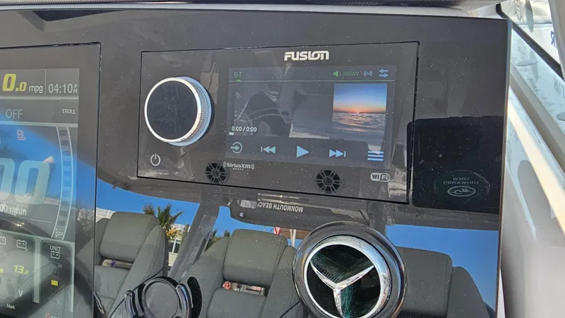  Yacht Photos Pics Control panel of a 2021 Regal 38 SAV boat with Fusion audio system.
