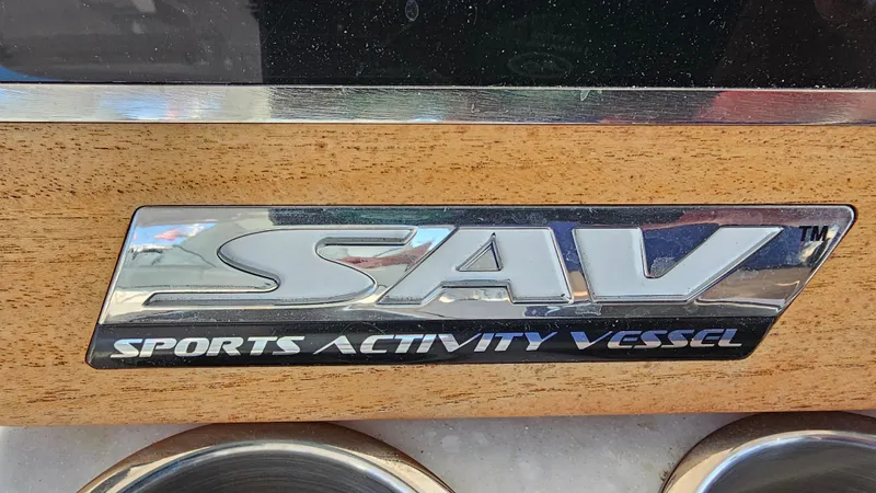  Yacht Photos Pics 2021 Regal 38 SAV Sports Activity Vessel emblem on wooden panel.