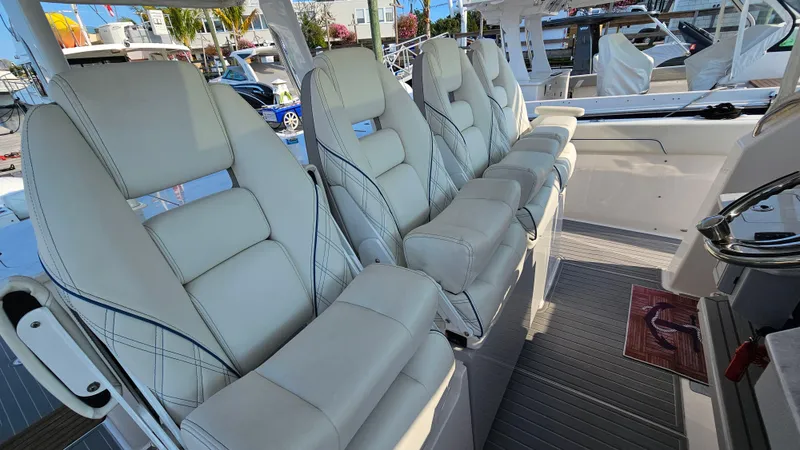  Yacht Photos Pics 2021 Regal 38 SAV boat interior with luxurious white seating.