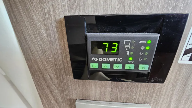  Yacht Photos Pics Dometic thermostat displaying 73 degrees on a 2021 Regal 38 SAV boat.