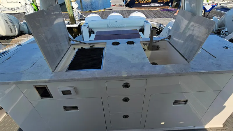 Yacht Photos Pics 2021 Regal 38 SAV boat kitchen area with sink and grill.