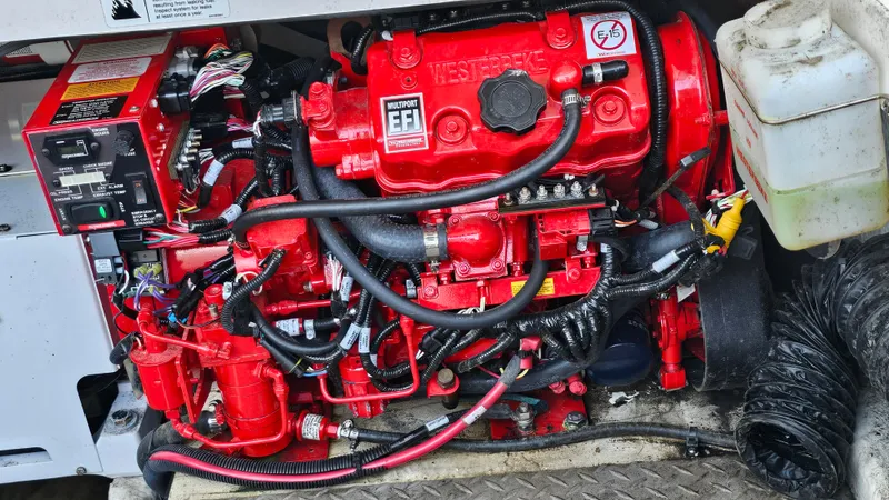  Yacht Photos Pics Red engine of a 2021 Regal 38 SAV boat, showcasing intricate components and wiring.