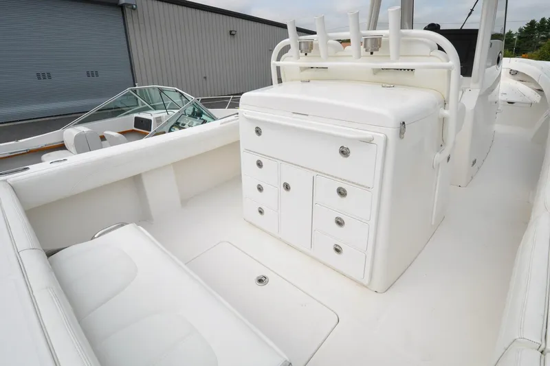 Blue Fox Yacht Photos Pics 2021 Regulator 31 boat interior with white seating and storage compartments.