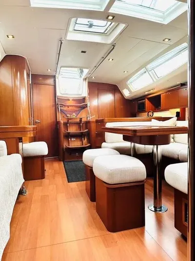 Karuna Ss Yacht Photos Pics Luxurious interior of a 2007 Beneteau 49' Cruiser with elegant wood finishes.