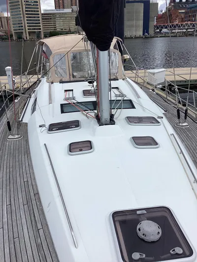 Karuna Ss Yacht Photos Pics 2007 Beneteau 49' Cruiser sailboat docked, showcasing sleek deck design and urban waterfront backdrop.