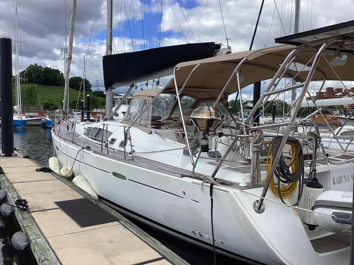 Karuna Ss Yacht Photos Pics 2007 Beneteau 49' Cruiser yacht docked at marina under cloudy sky.