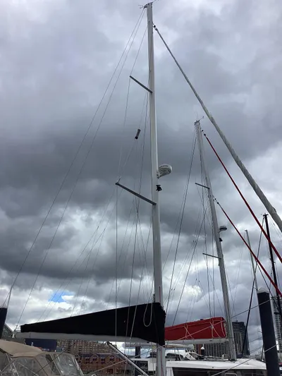 Karuna Ss Yacht Photos Pics Sailboat mast of a 2007 Beneteau 49' Cruiser under cloudy skies.