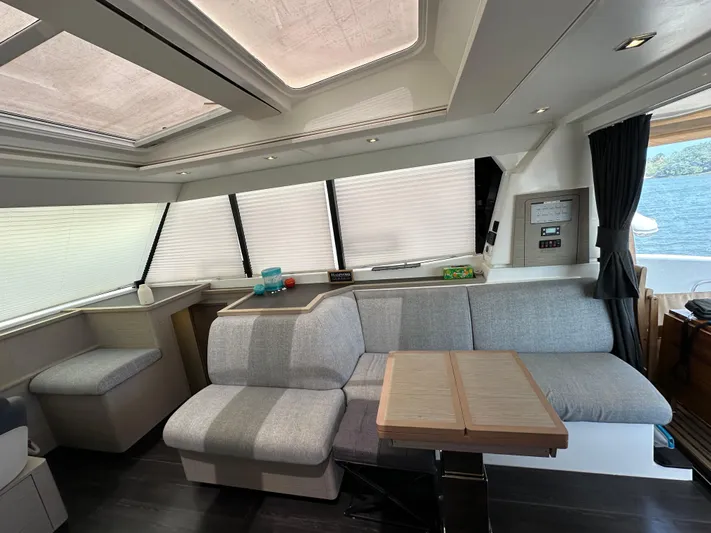 Vie Pure Yacht Photos Pics Luxurious interior of 2021 Fountaine Pajot MY4.S yacht with modern seating and table.