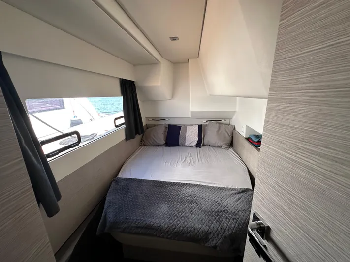 Vie Pure Yacht Photos Pics Cozy bedroom interior of 2021 Fountaine Pajot MY4.S yacht with ocean view.