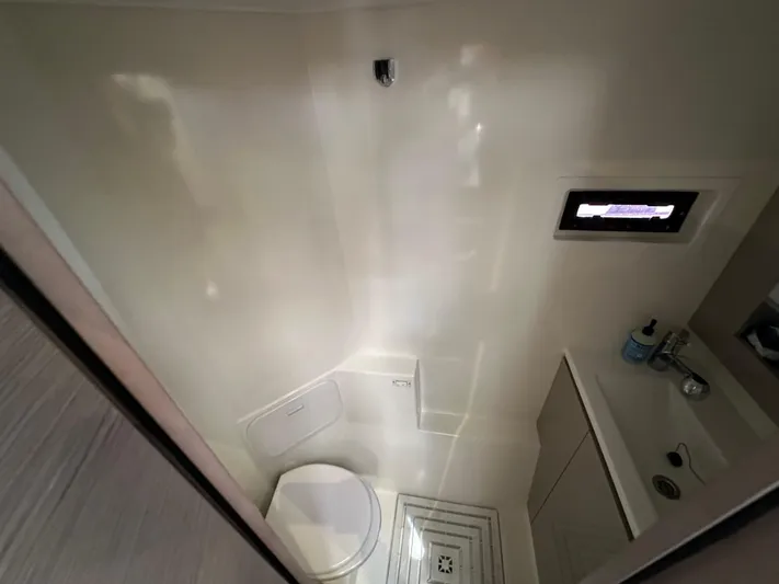 Vie Pure Yacht Photos Pics Compact bathroom in 2021 Fountaine Pajot MY4.S yacht, featuring toilet and sink.