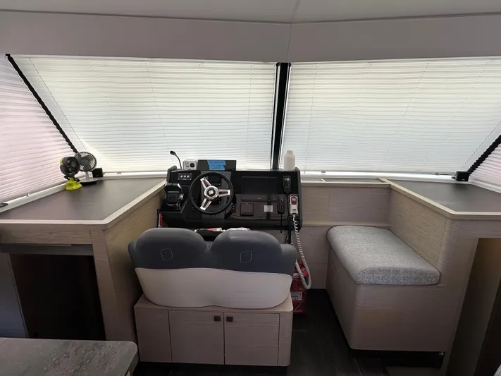 Vie Pure Yacht Photos Pics 2021 Fountaine Pajot MY4.S helm station with modern controls and seating.