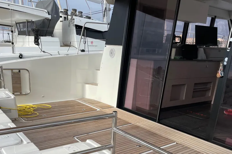 Vie Pure Yacht Photos Pics 2021 Fountaine Pajot MY4.S yacht deck with modern interior and wooden flooring.