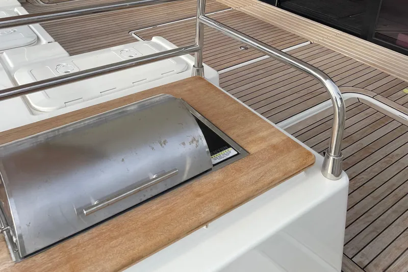 Vie Pure Yacht Photos Pics Outdoor grill on 2021 Fountaine Pajot MY4.S yacht deck with wooden finish.