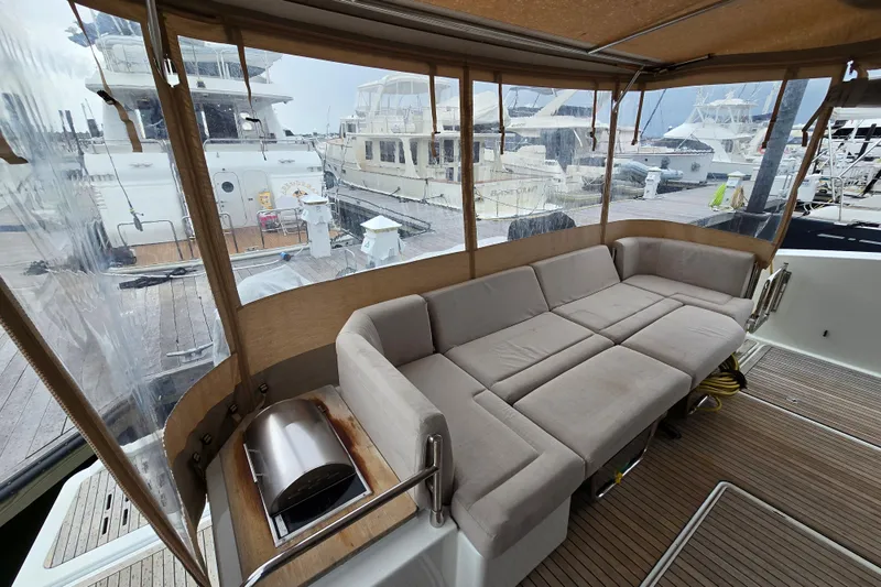 Vie Pure Yacht Photos Pics Luxurious 2021 Fountaine Pajot MY4.S yacht interior with plush seating and marina view.