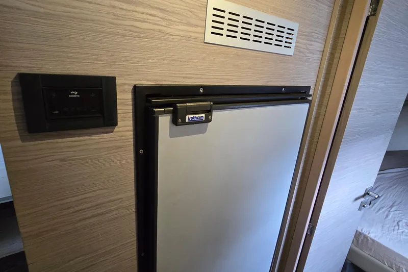 Vie Pure Yacht Photos Pics Interior of 2021 Fountaine Pajot MY4.S yacht with compact fridge and control panel.