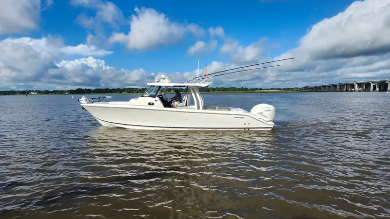 Blown Dough Yacht Photos Pics 2023 Pursuit S 358 Sport boat cruising on a sunny day with blue skies.