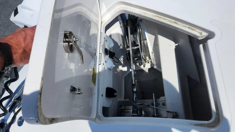Blown Dough Yacht Photos Pics Open hatch of 2023 Pursuit S 358 Sport boat showing mechanical components.