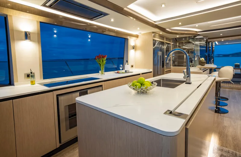 Aquila 70 Yacht Photos Pics Luxurious kitchen interior of 2026 Aquila 70 Luxury yacht with modern design and ocean view.