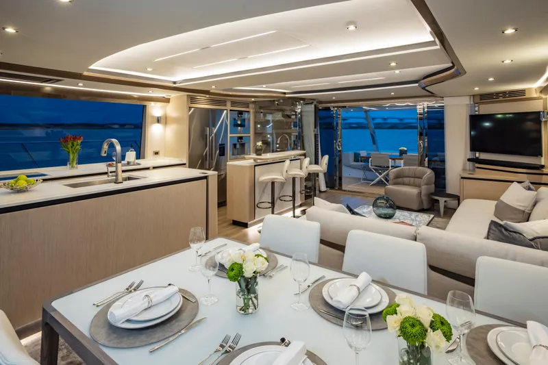 Aquila 70 Yacht Photos Pics Luxurious interior of 2026 Aquila 70 Luxury yacht with elegant dining and living areas.