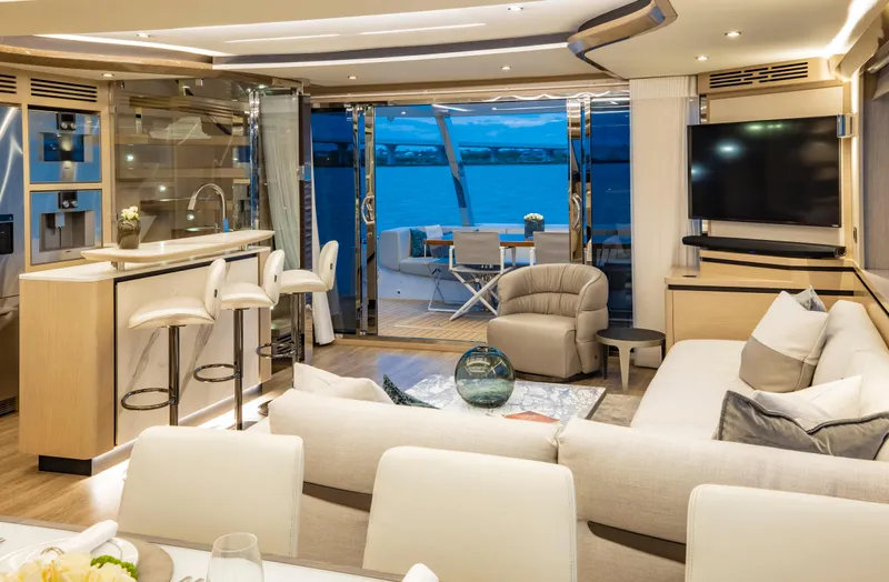 Aquila 70 Yacht Photos Pics Luxurious interior of 2026 Aquila 70 yacht with modern furnishings and ocean view.