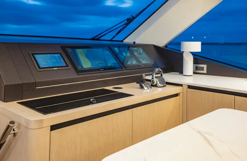 Aquila 70 Yacht Photos Pics Helm station of 2026 Aquila 70 Luxury yacht with modern navigation displays.
